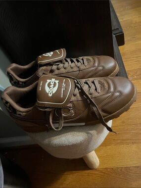 Coach Men’s Brown Leather Sneaker with Leopard Heel Accent